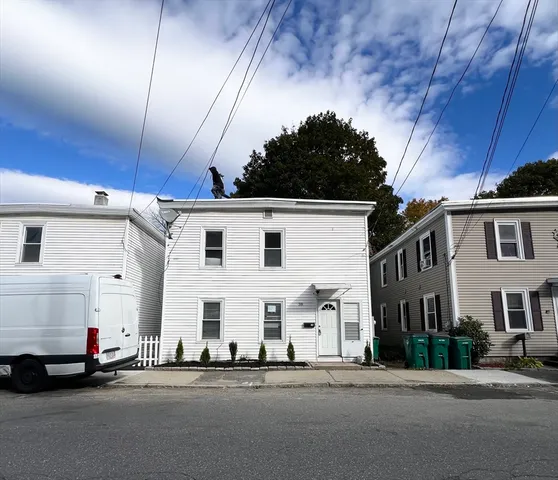 a front view of a building with a road