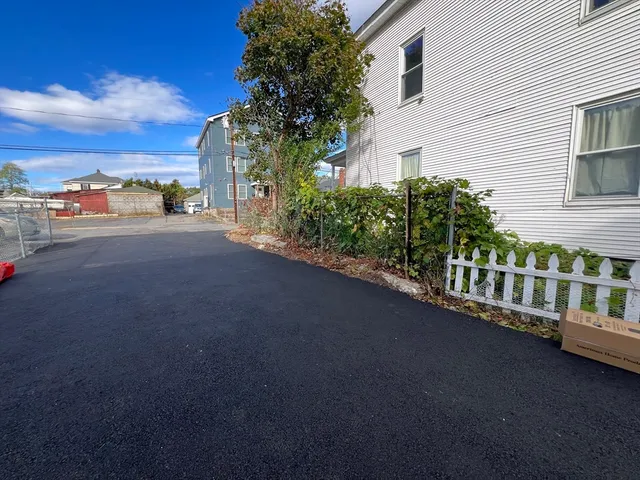 a view of a street with a house