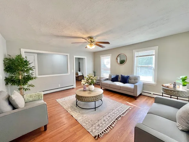 a living room with furniture and a large window