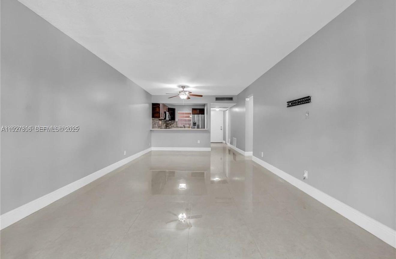9431 Live Oak Place, Unit 205 Davie, FL 33324 - Photo 4 of 13 a view of empty room