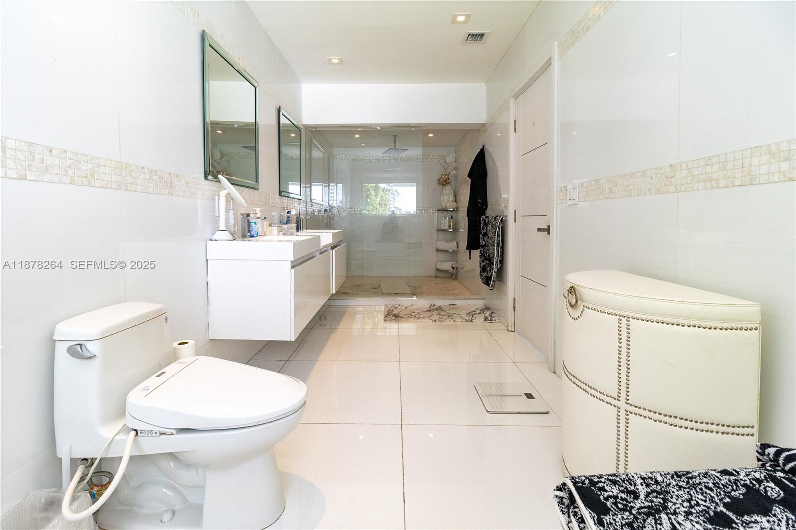 1215 North Biscayne Point Road Miami Beach, FL 33141 - Photo 29 of 54 a bathroom with a toilet sink and shower
