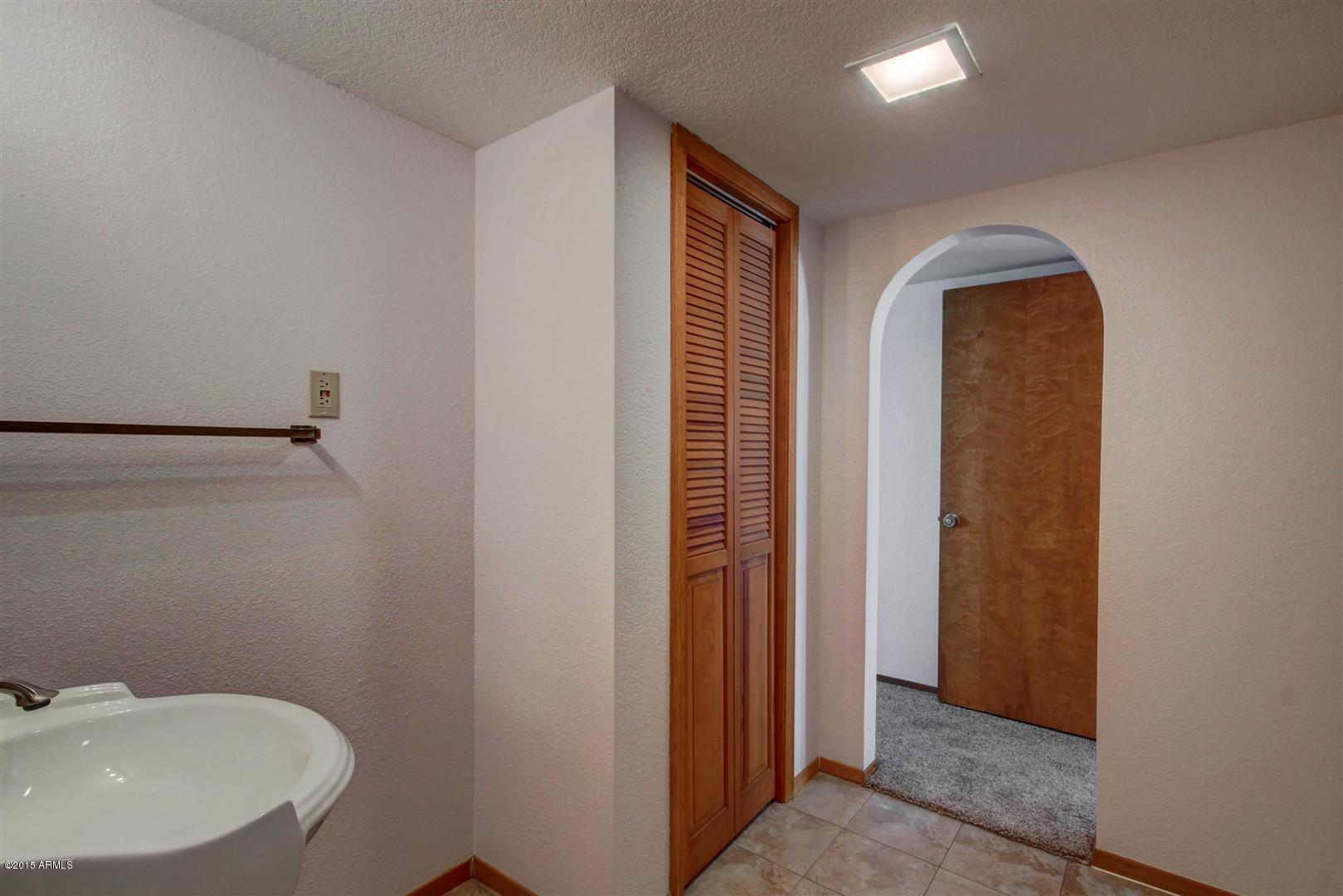 949 South Bowman Road Apache Junction, AZ 85119 - Photo 34 of 51 a bathroom with a sink and a mirror