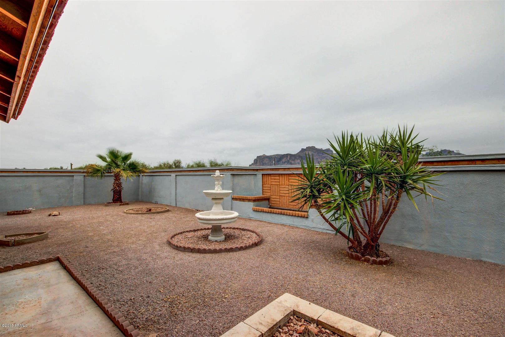 949 South Bowman Road Apache Junction, AZ 85119 - Photo 41 of 51 a view of a house with backyard and sitting area