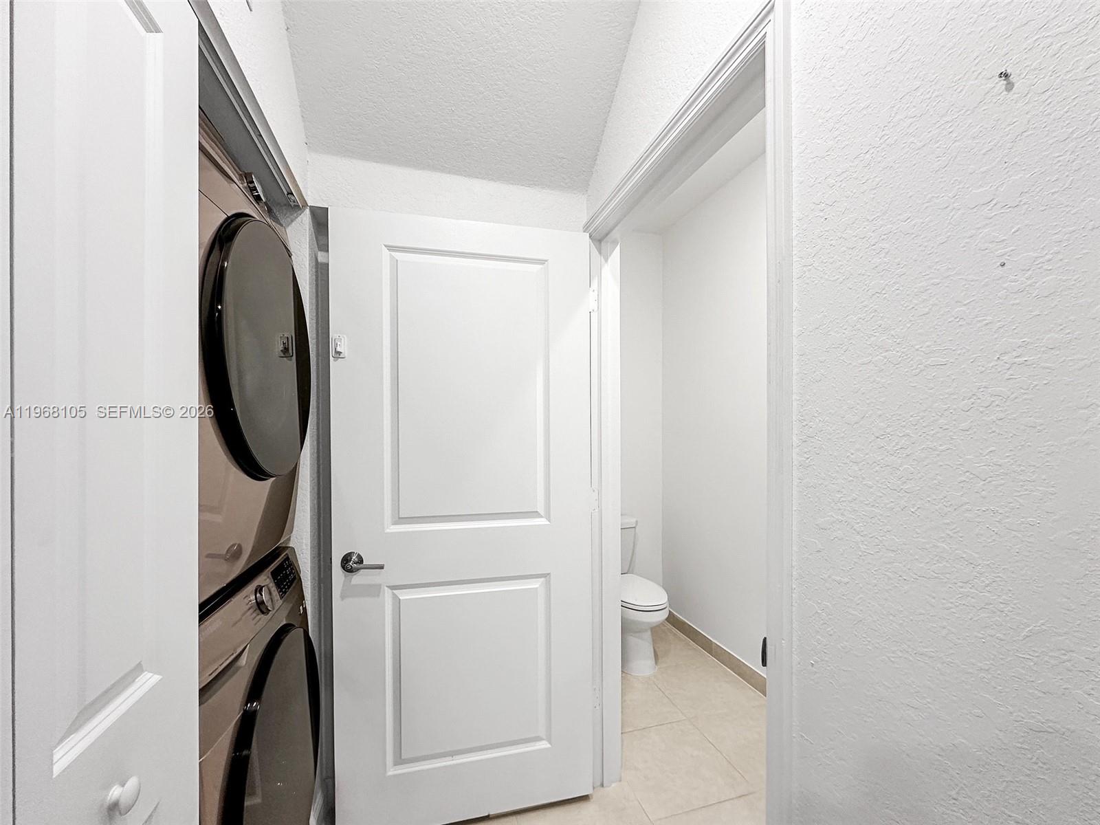13402 Southwest 286th Street, Unit 13402 Homestead, FL 33033 - Photo 12 of 43 a utility room with dryer and washer