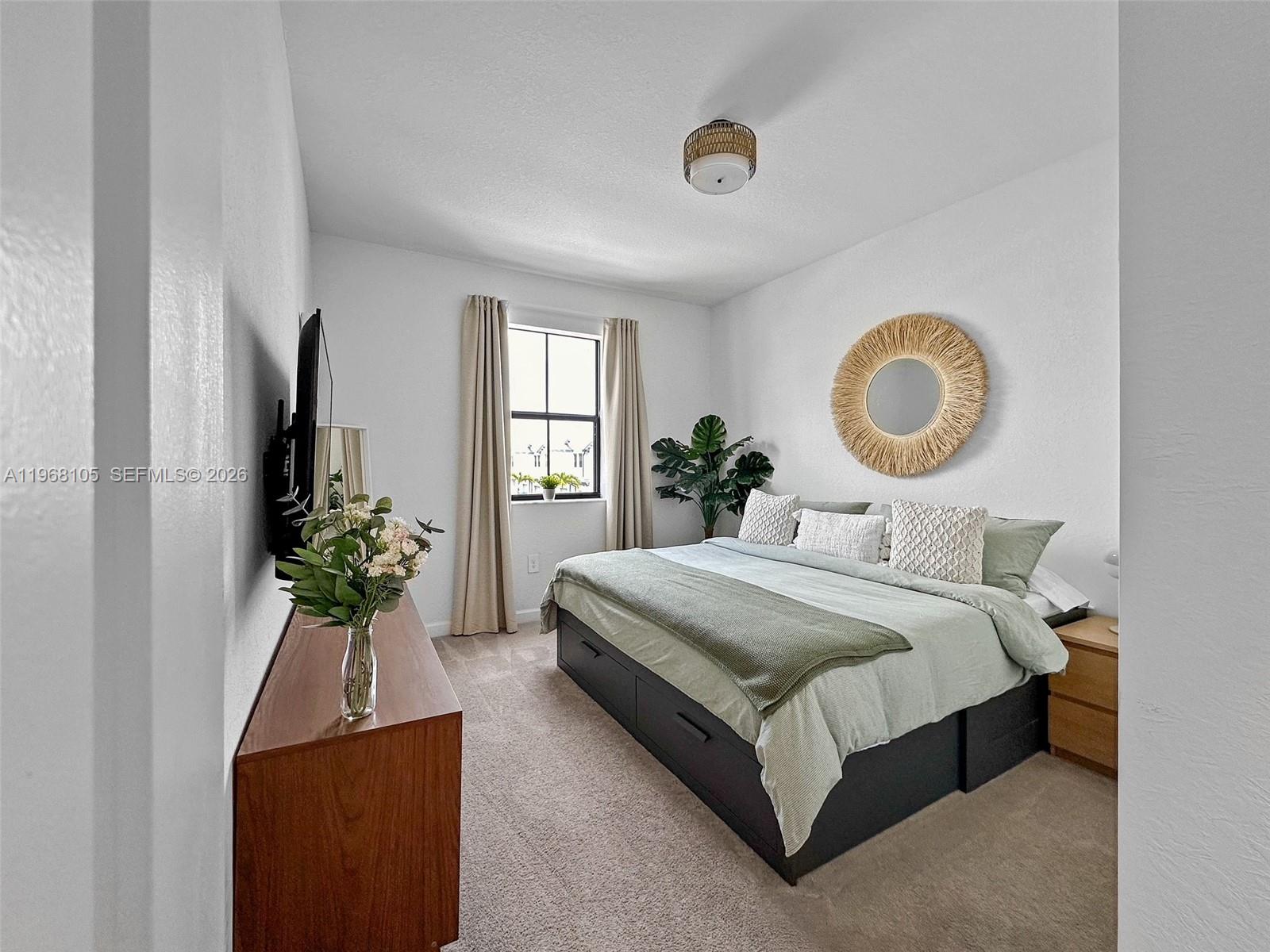 13402 Southwest 286th Street, Unit 13402 Homestead, FL 33033 - Photo 14 of 43 a bedroom with bed and a window