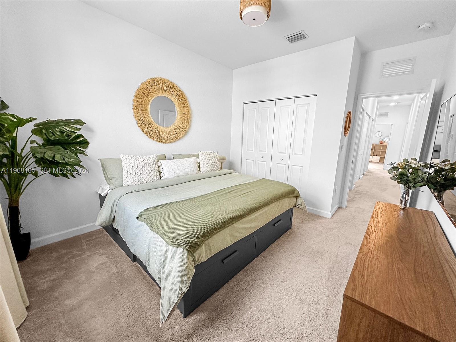 13402 Southwest 286th Street, Unit 13402 Homestead, FL 33033 - Photo 15 of 43 a bedroom with a bed and a potted plant