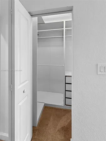 a view of an empty walk in closet