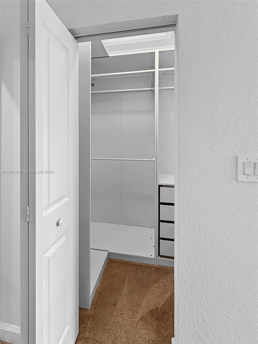 13402 Southwest 286th Street, Unit 13402 Homestead, FL 33033 - Photo 16 of 43 a view of an empty walk in closet