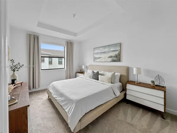 a bed room with a bed and a window