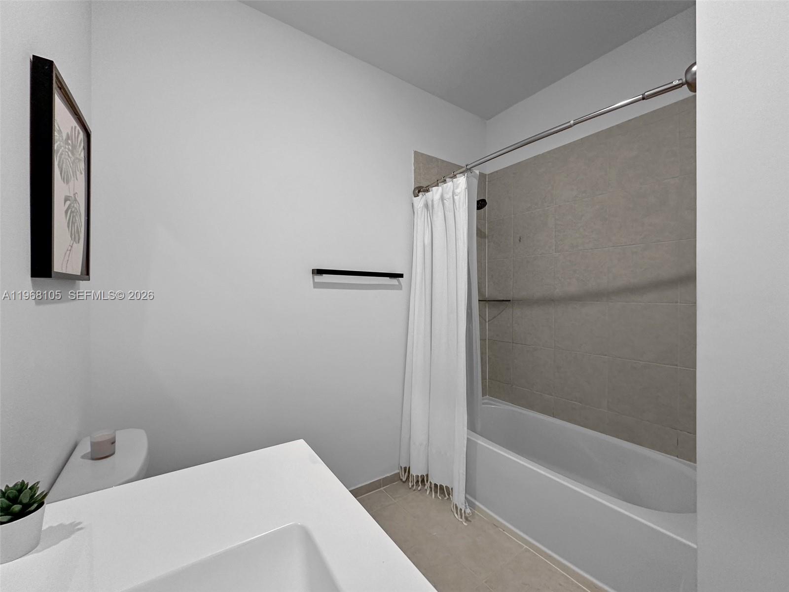 13402 Southwest 286th Street, Unit 13402 Homestead, FL 33033 - Photo 25 of 43 a bathroom with a bathtub and a shower