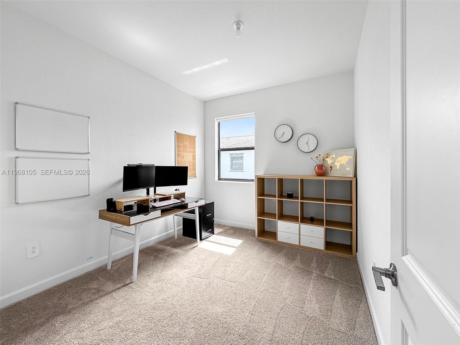 13402 Southwest 286th Street, Unit 13402 Homestead, FL 33033 - Photo 27 of 43 a living room with furniture and a flat screen tv