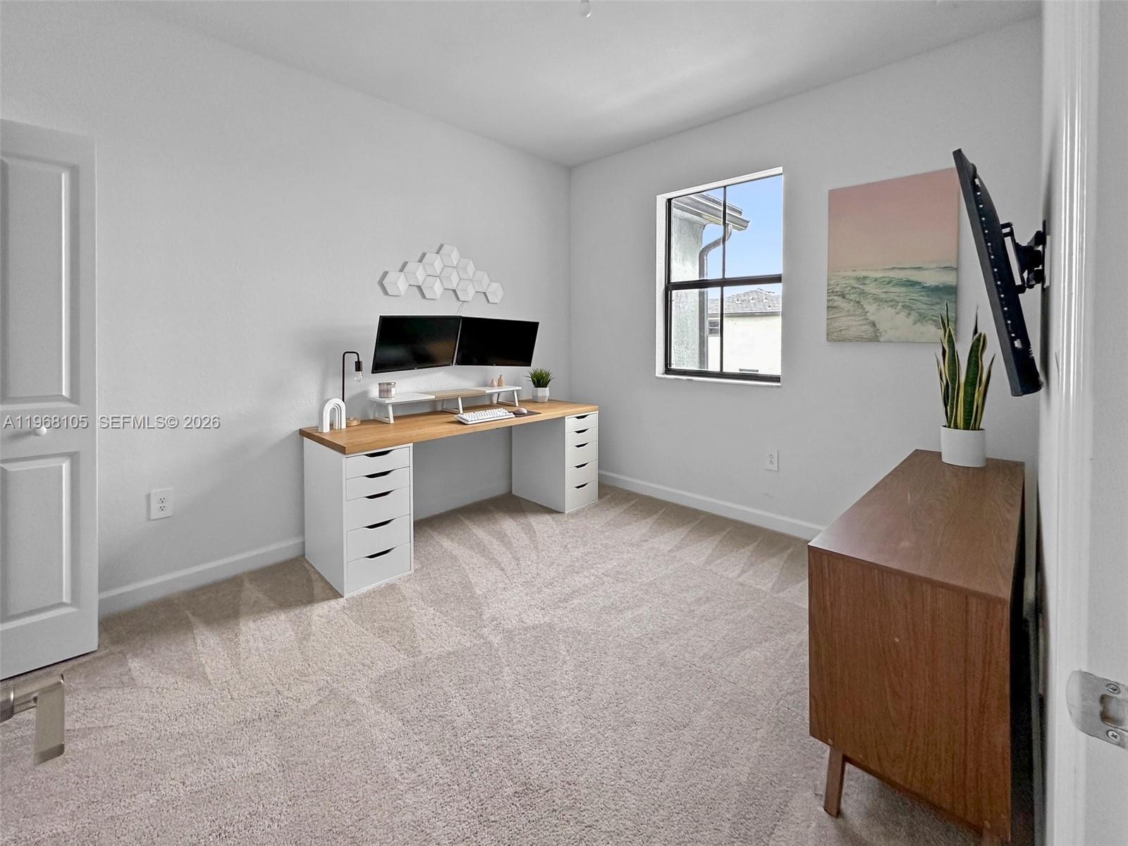 13402 Southwest 286th Street, Unit 13402 Homestead, FL 33033 - Photo 28 of 43 a view of a workspace with furniture and a window