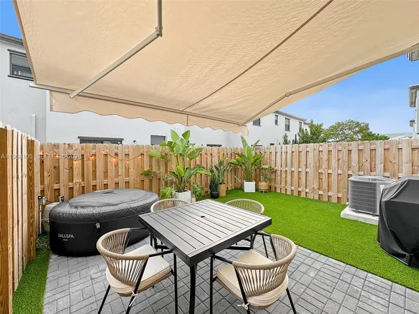 a view of a back yard of the house