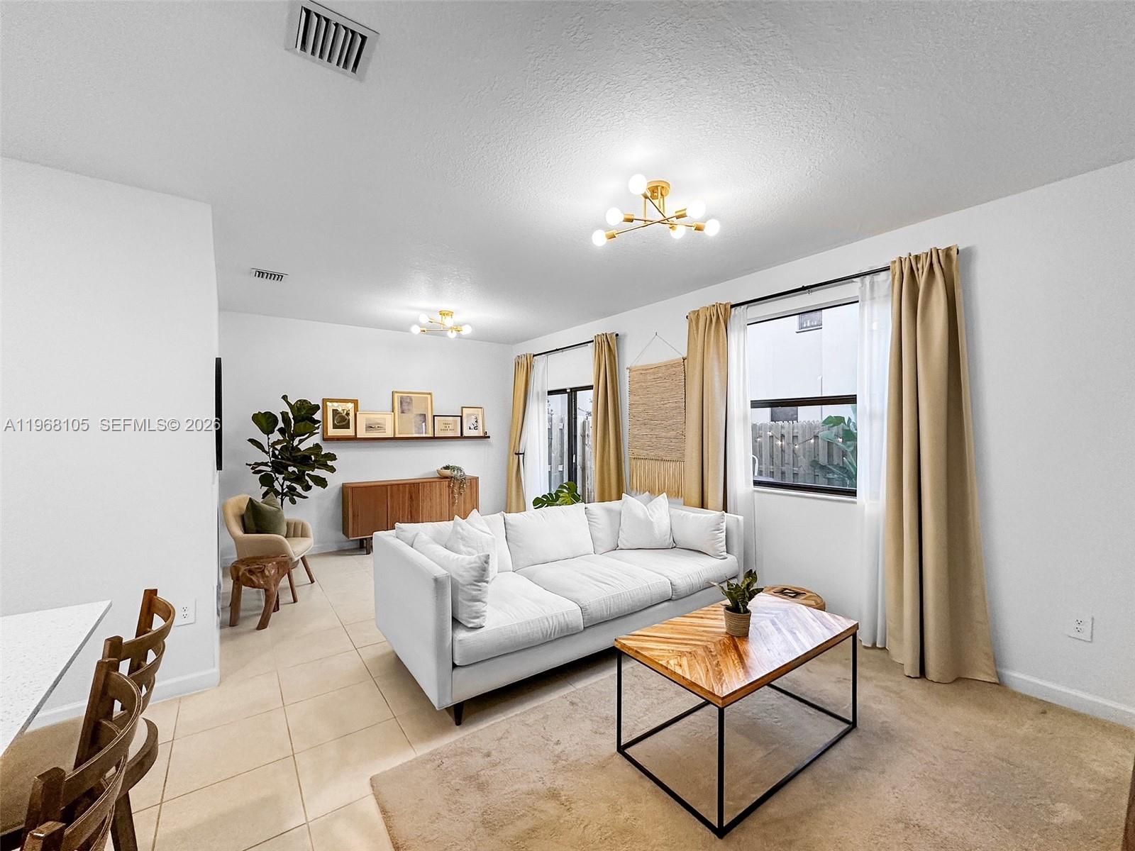 13402 Southwest 286th Street, Unit 13402 Homestead, FL 33033 - Photo 3 of 43 a living room with furniture