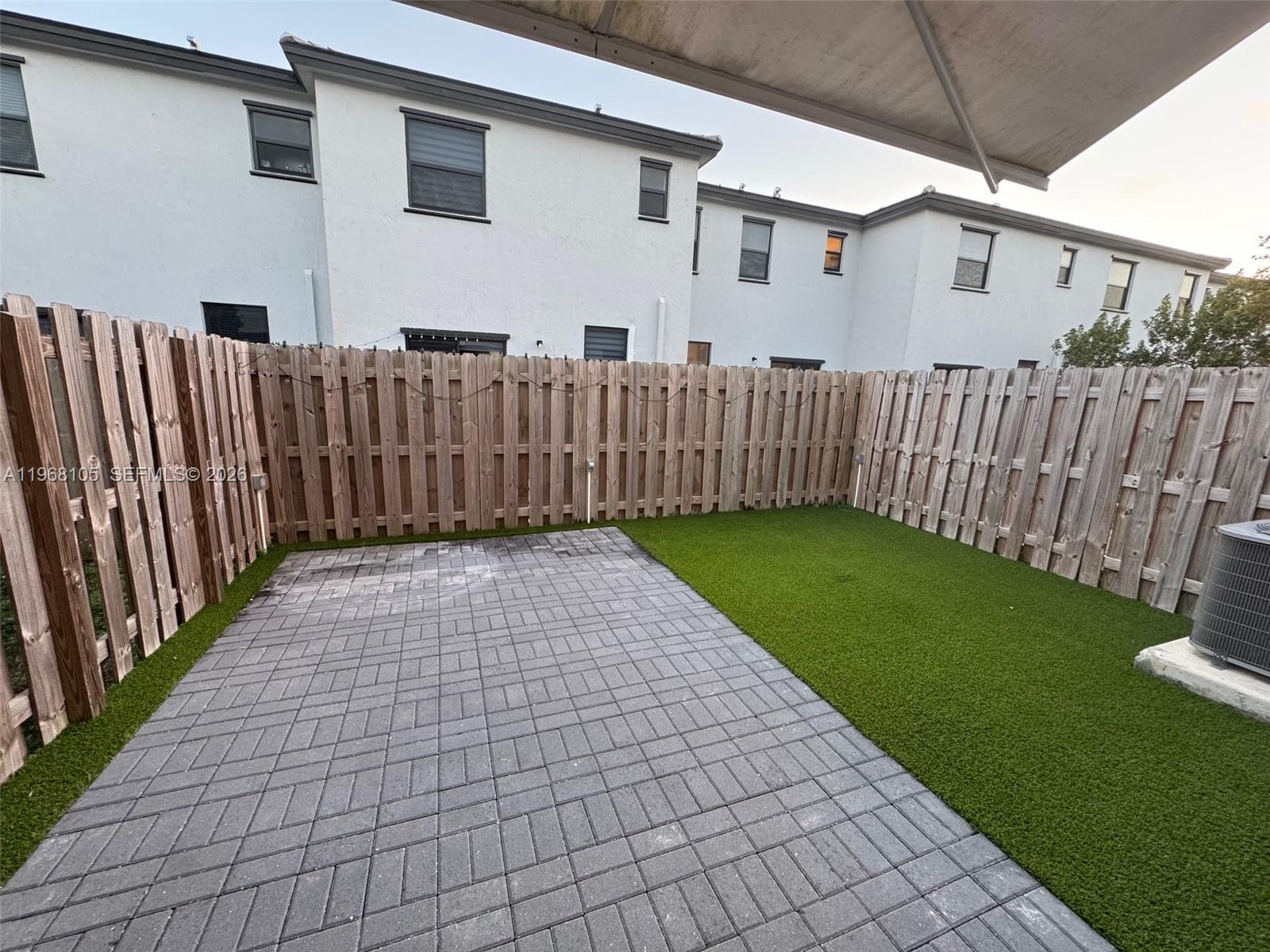 13402 Southwest 286th Street, Unit 13402 Homestead, FL 33033 - Photo 31 of 43 a view of a back yard of the house