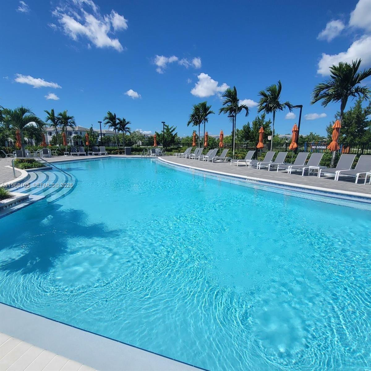 13402 Southwest 286th Street, Unit 13402 Homestead, FL 33033 - Photo 38 of 43 a view of a house with a swimming pool