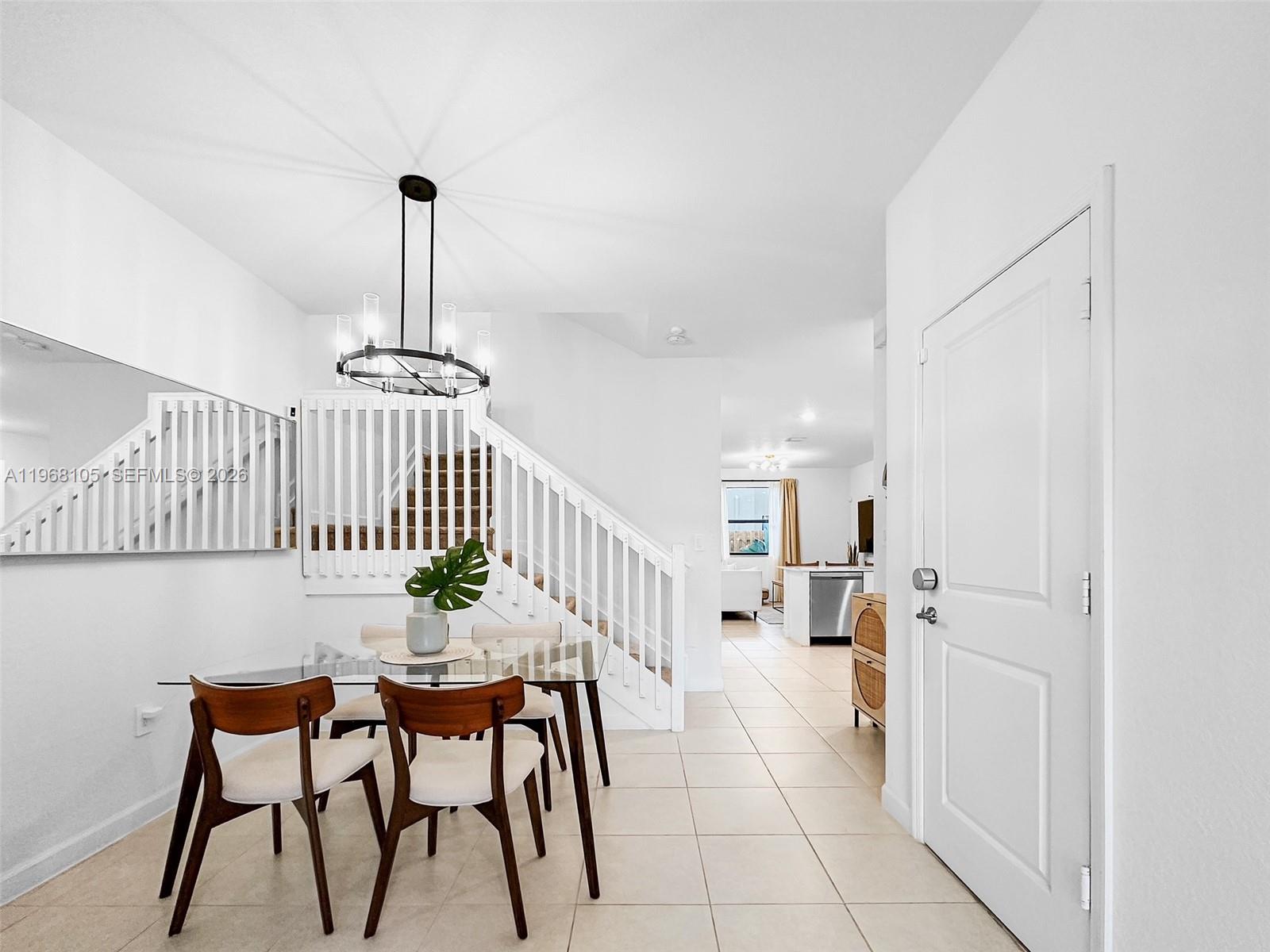 13402 Southwest 286th Street, Unit 13402 Homestead, FL 33033 - Photo 10 of 43 a dining room with furniture and wooden floor