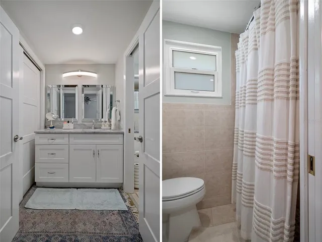 a bathroom with a toilet a sink and glass door