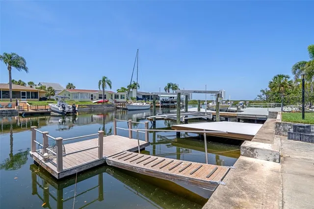 a view of a rooftop with chairs and a outdoor view
