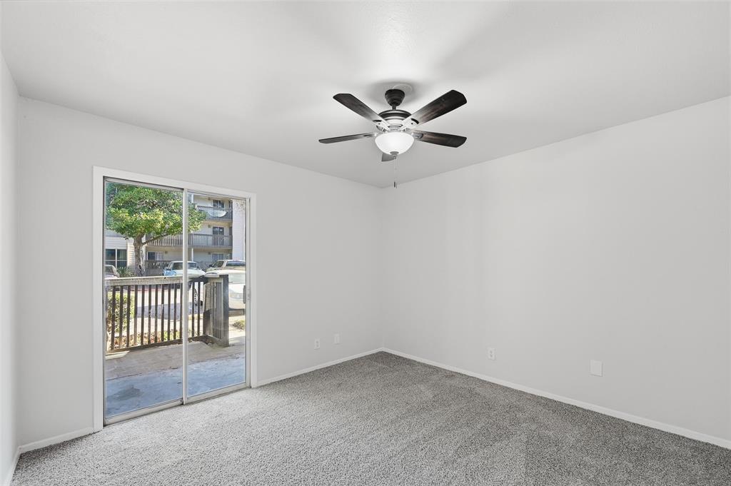 4851 Cedar Springs Road, Unit 189 Dallas, TX 75219 - Photo 14 of 29 an empty room with a window