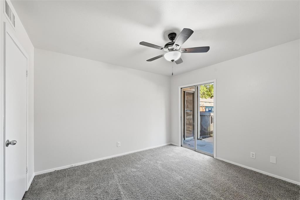 4851 Cedar Springs Road, Unit 189 Dallas, TX 75219 - Photo 15 of 29 an empty room with a ceiling fan and a window