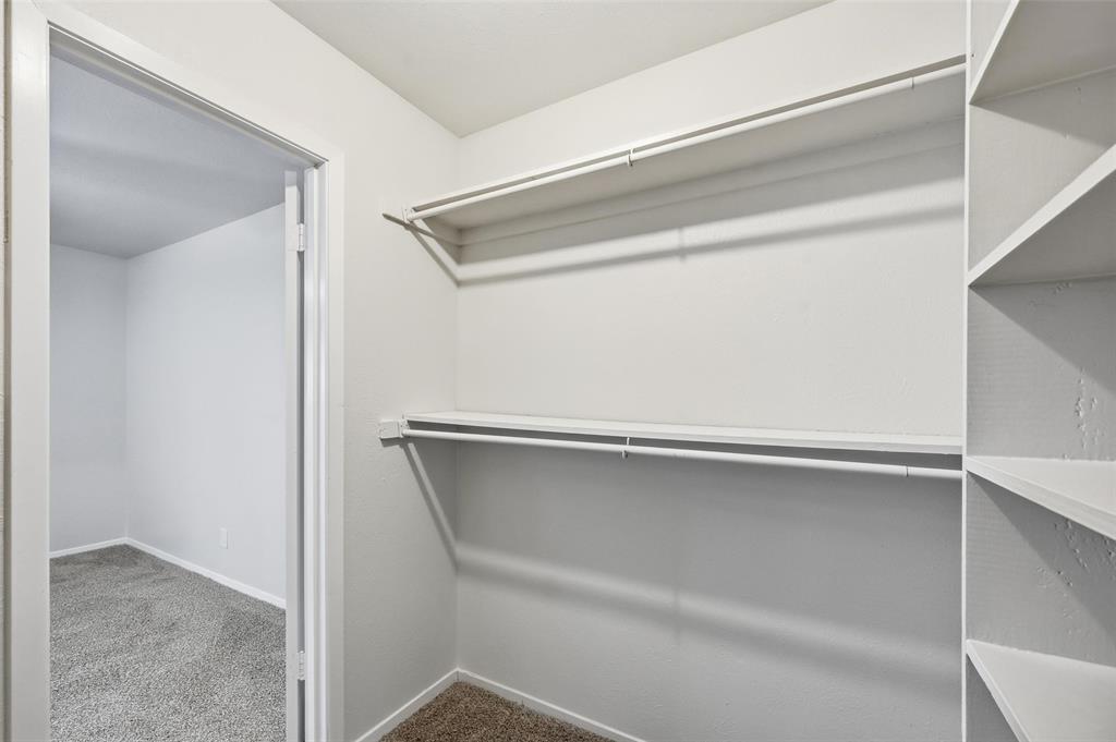 4851 Cedar Springs Road, Unit 189 Dallas, TX 75219 - Photo 19 of 29 a view of an empty walk in closet