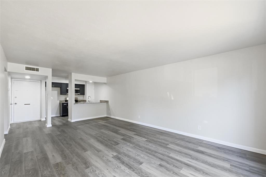 4851 Cedar Springs Road, Unit 189 Dallas, TX 75219 - Photo 5 of 29 a view of a kitchen with wooden floor