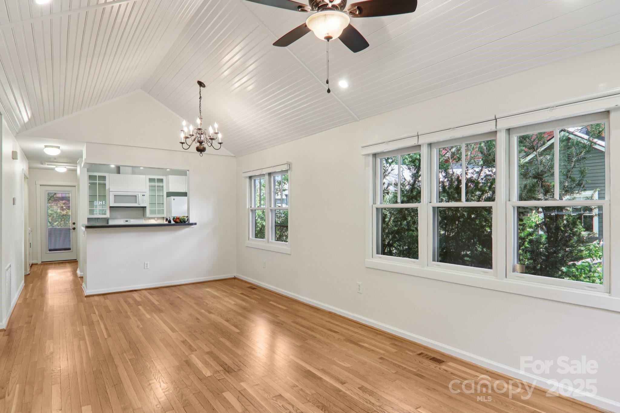 39 Short Street Asheville, NC 28801 - Photo 11 of 47 a view of empty room with wooden floor and fan