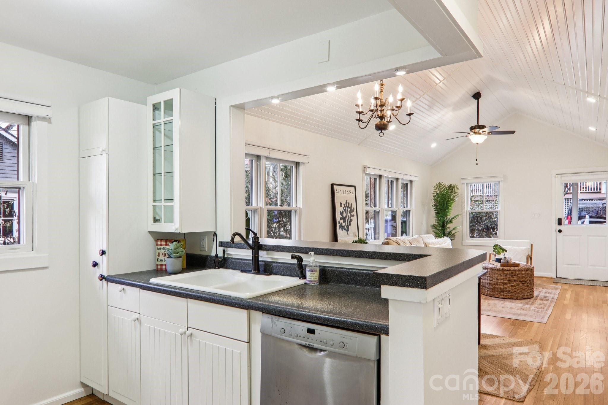 39 Short Street Asheville, NC 28801 - Photo 14 of 39 a kitchen with a sink cabinets and wooden floor