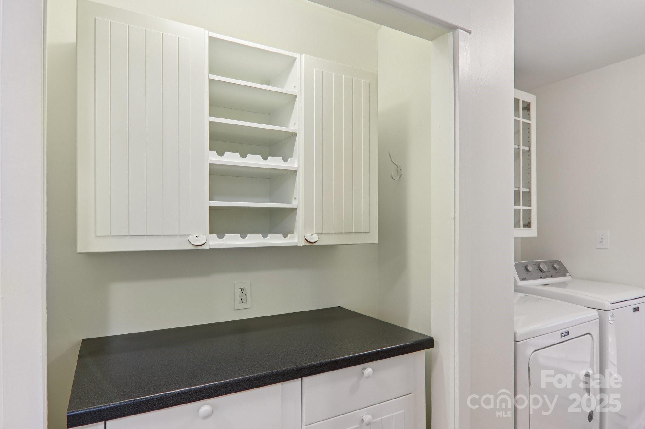 39 Short Street Asheville, NC 28801 - Photo 16 of 47 a kitchen with a sink and cabinets