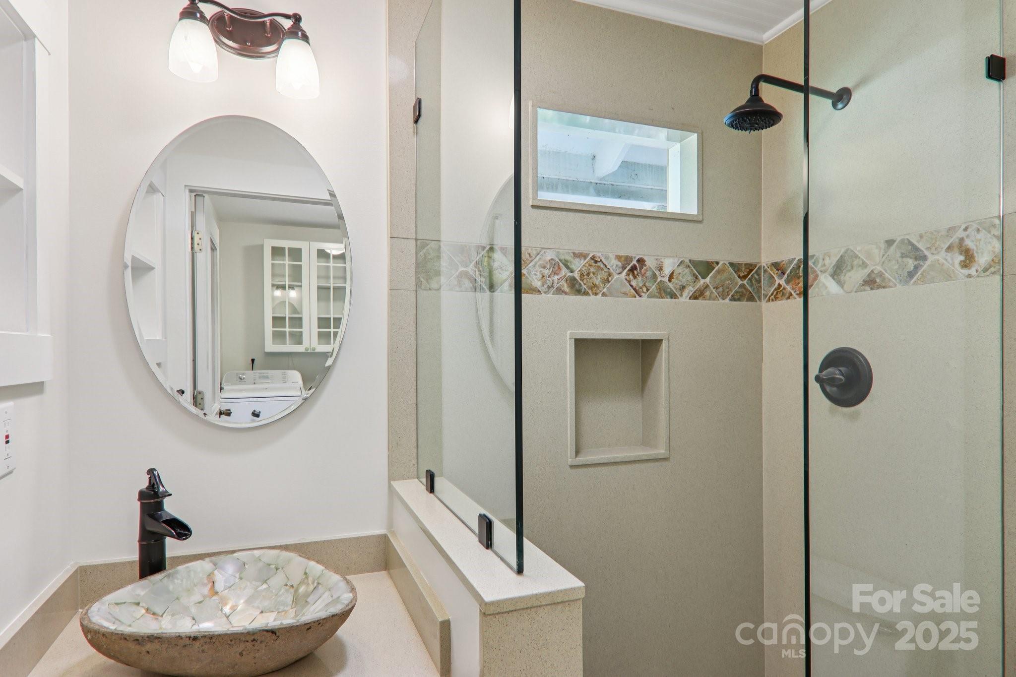 39 Short Street Asheville, NC 28801 - Photo 17 of 47 a bathroom with a toilet a sink and mirror
