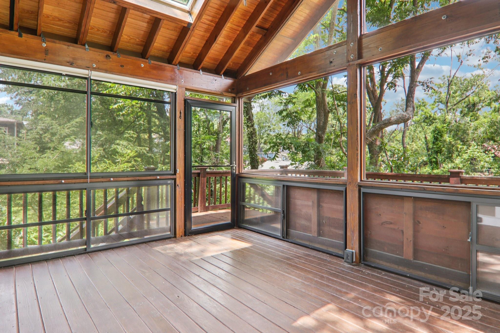 39 Short Street Asheville, NC 28801 - Photo 18 of 47 a view of a porch with wooden floor and outdoor space