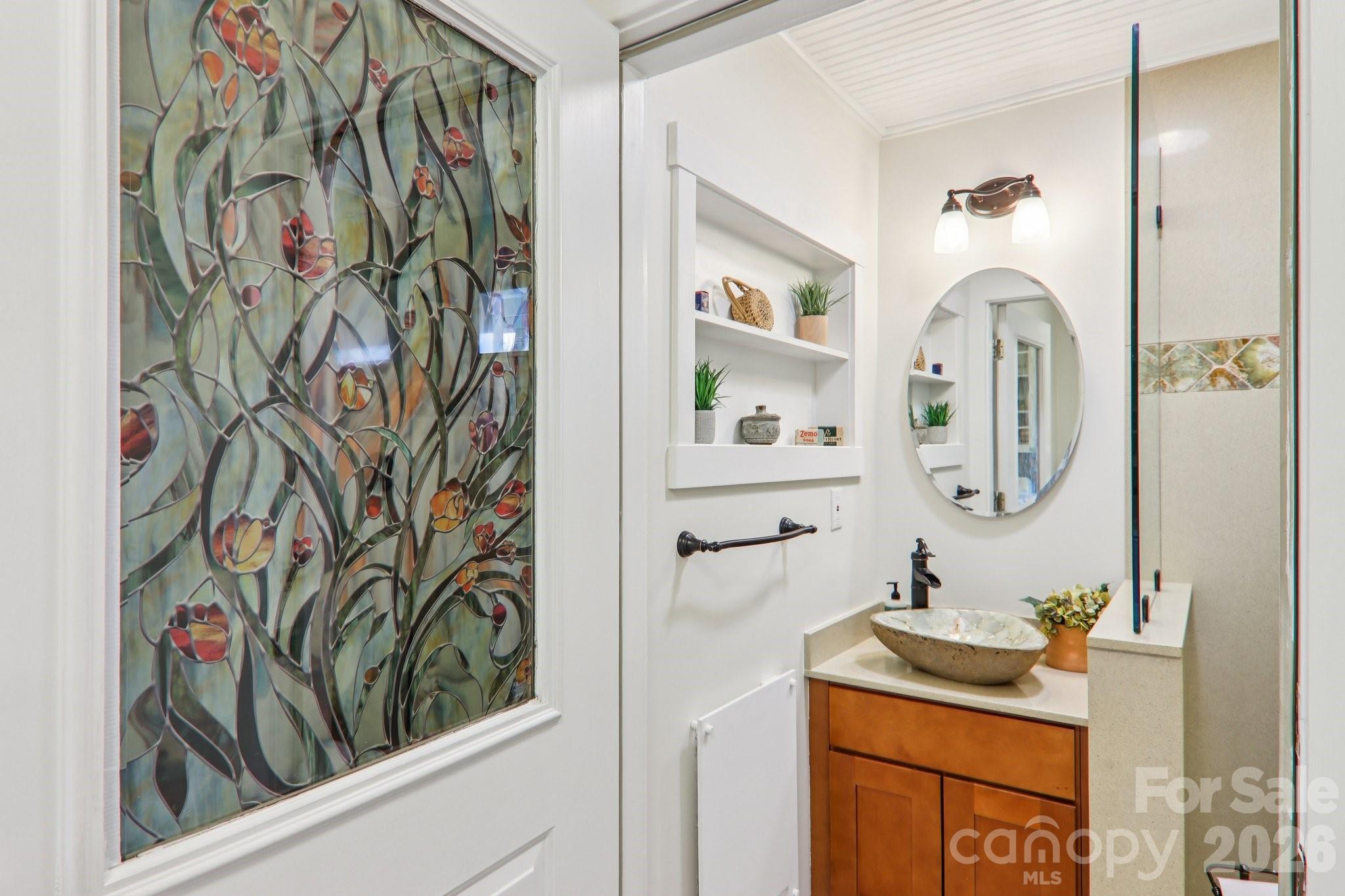 39 Short Street Asheville, NC 28801 - Photo 19 of 39 a bathroom with a sink and a mirror