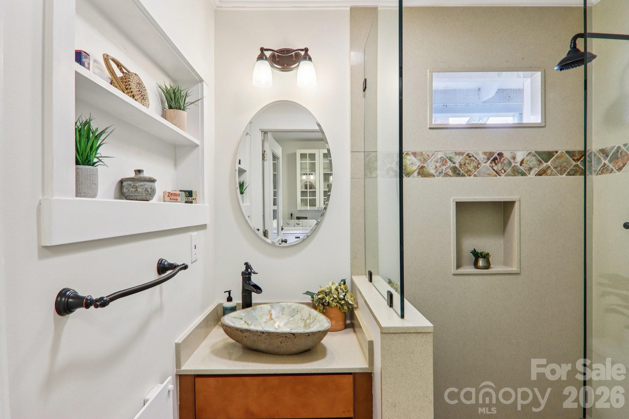 39 Short Street Asheville, NC 28801 - Photo 20 of 39 a bathroom with a sink mirror and vanity