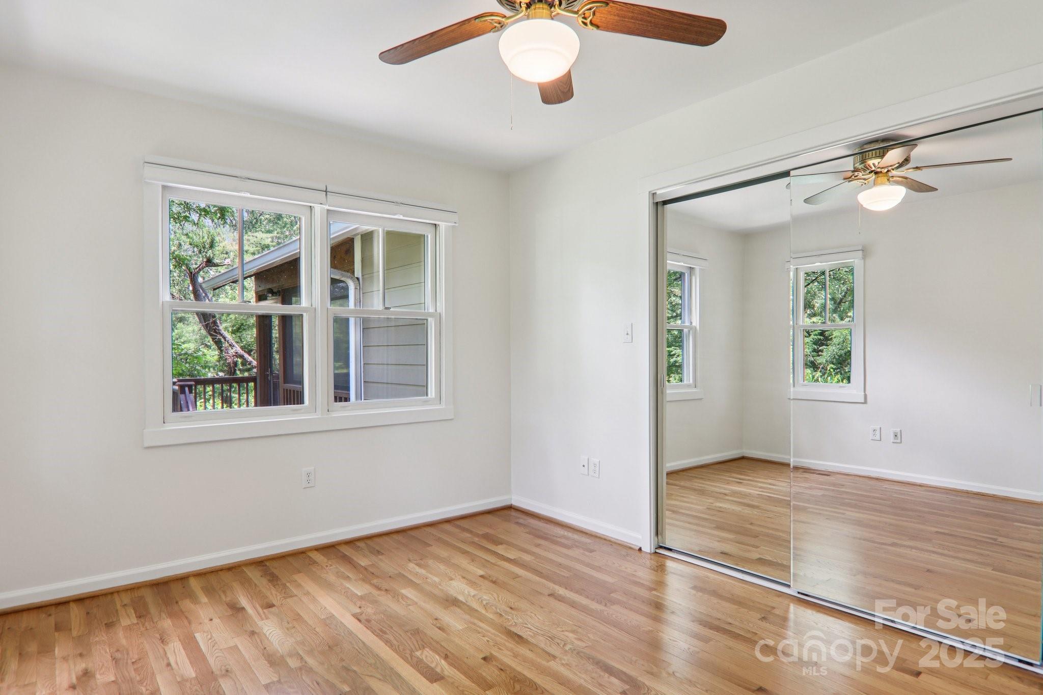 39 Short Street Asheville, NC 28801 - Photo 21 of 47 en view of an empty room with wooden floor and a window