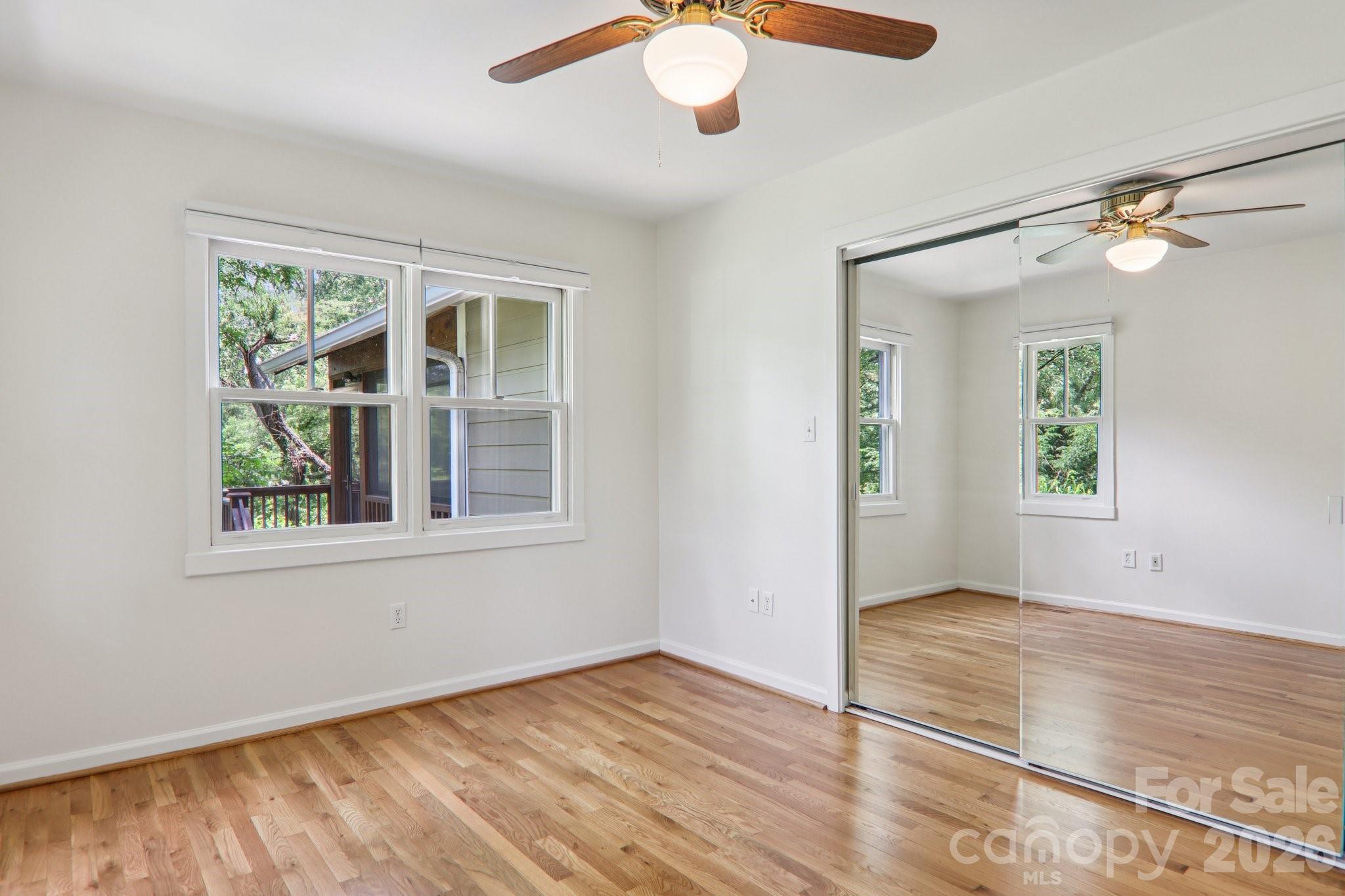 39 Short Street Asheville, NC 28801 - Photo 24 of 39 en view of an empty room with wooden floor and a window