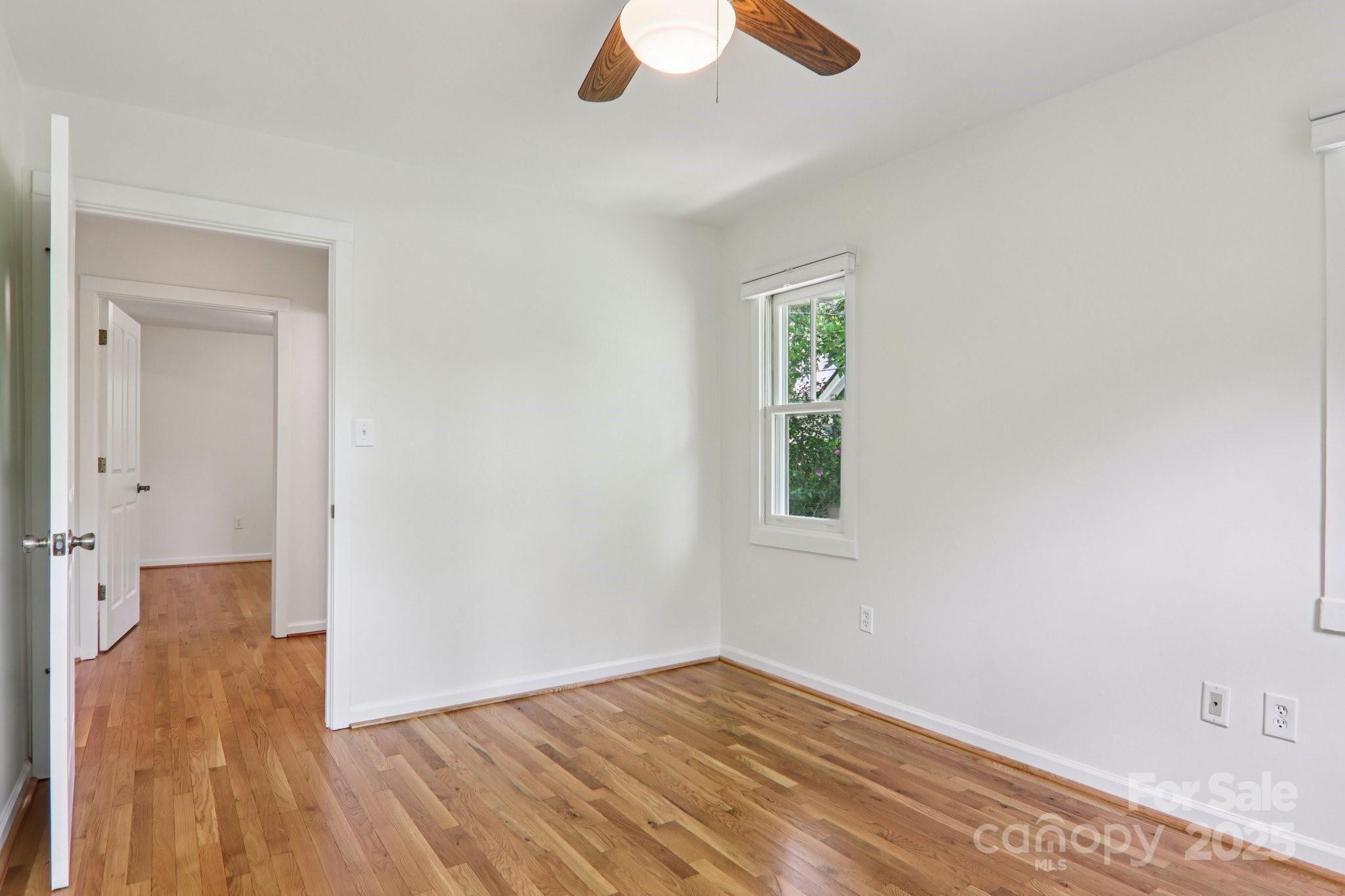 39 Short Street Asheville, NC 28801 - Photo 24 of 47 wooden floor in an empty room with a window