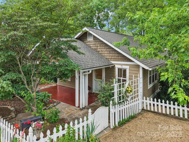 a front view of house with garden