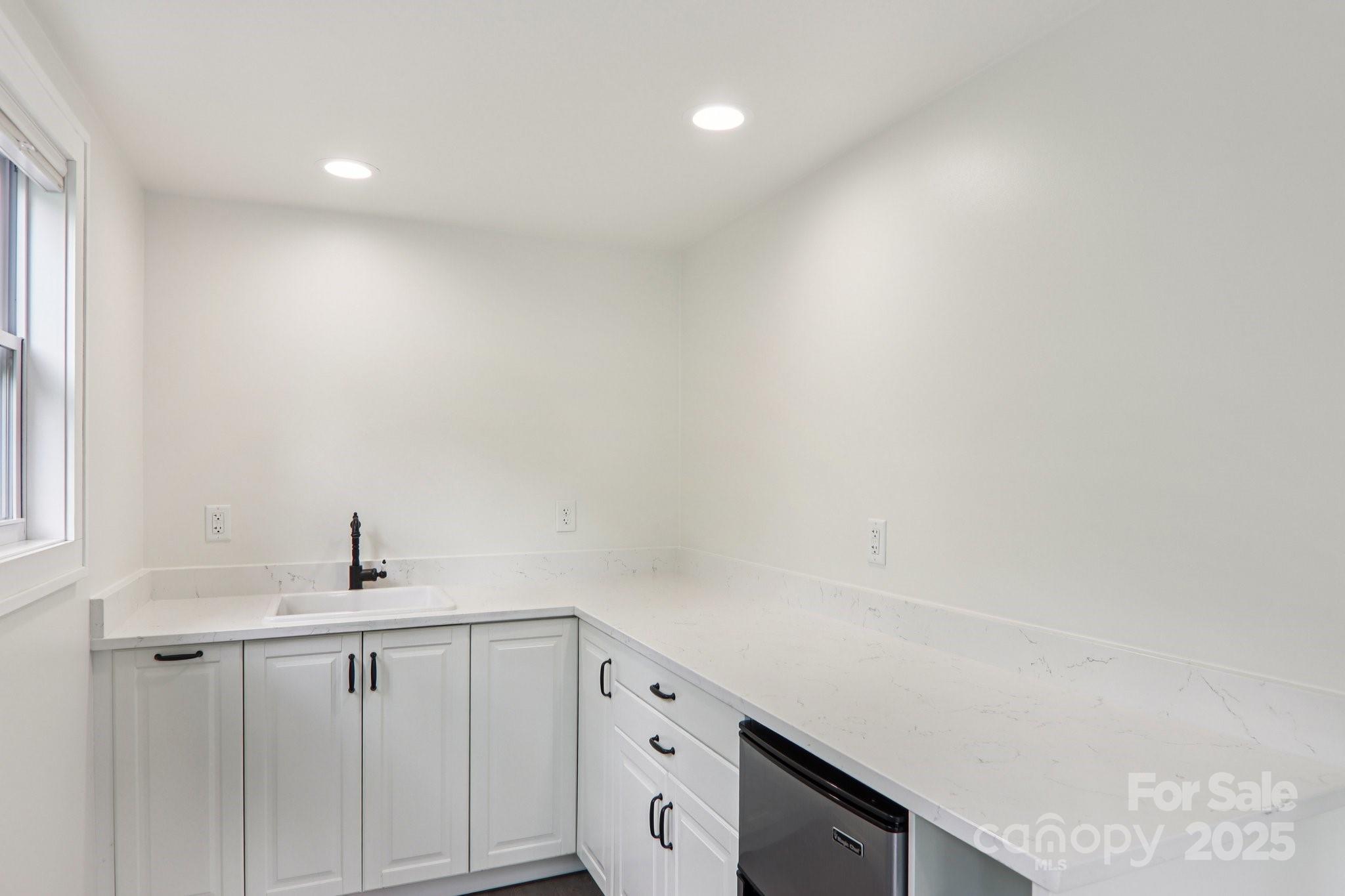 39 Short Street Asheville, NC 28801 - Photo 32 of 47 a bathroom with a sink and a mirror