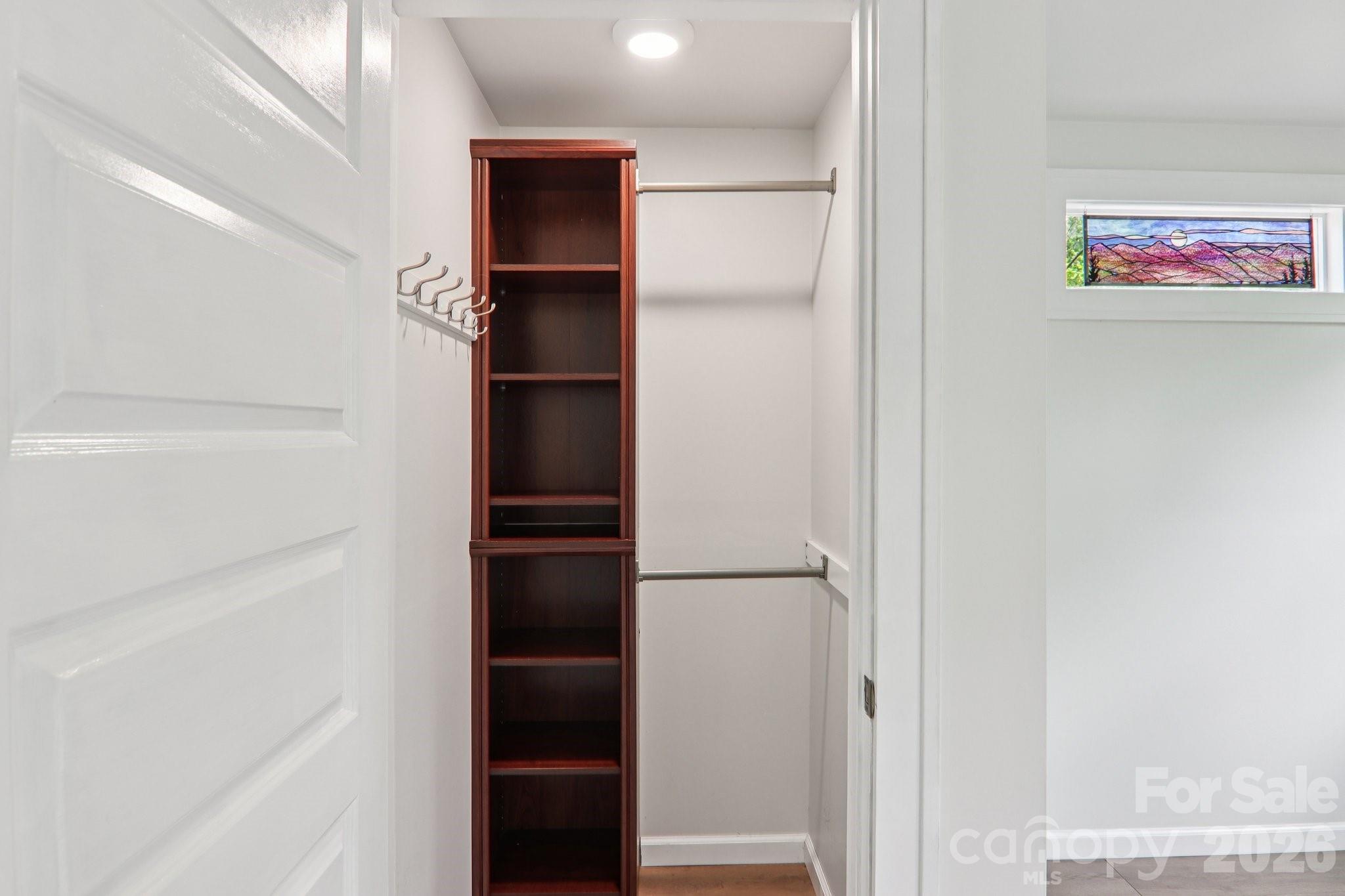 39 Short Street Asheville, NC 28801 - Photo 32 of 39 a view of walk in closet with empty racks