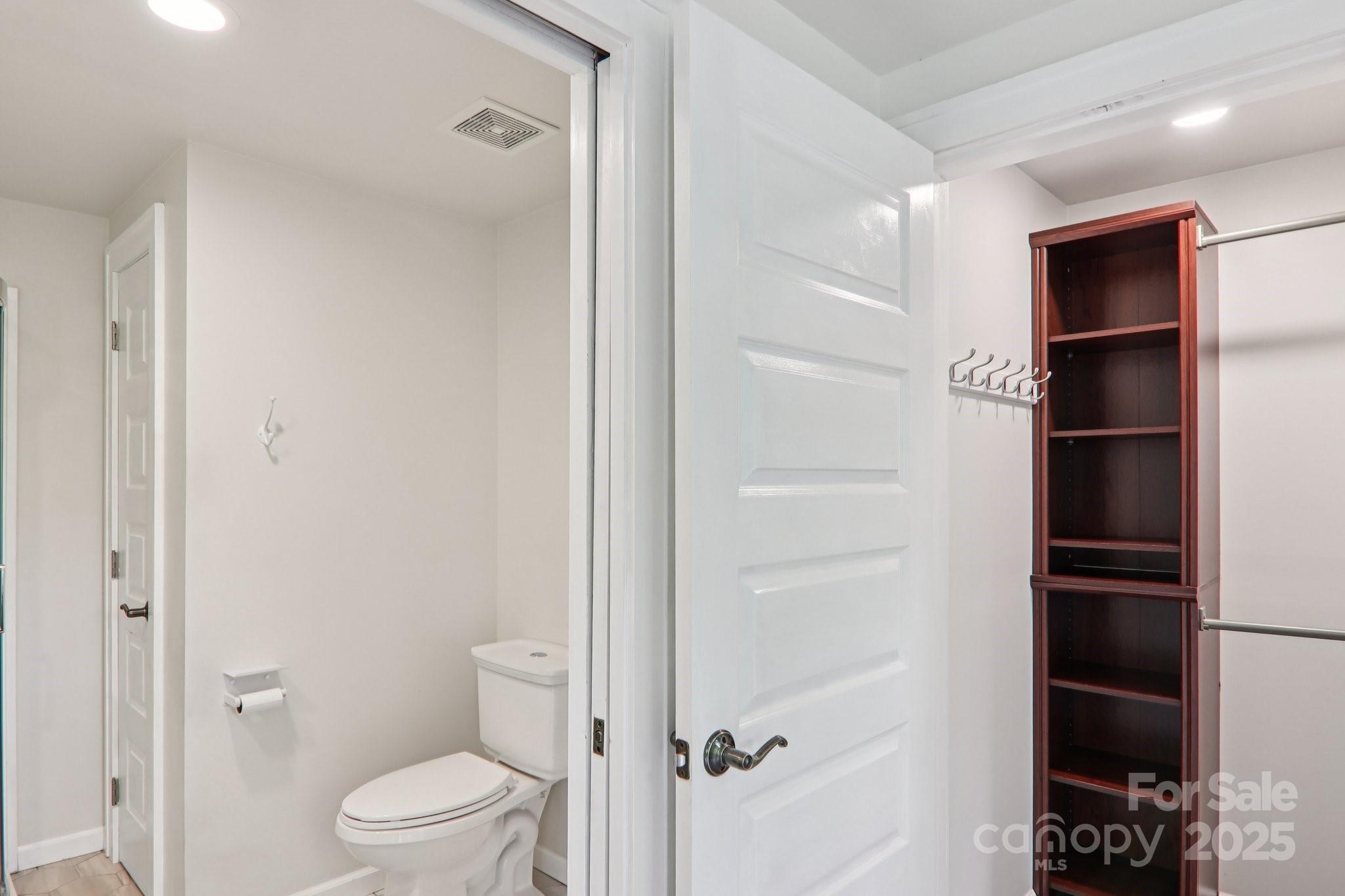 39 Short Street Asheville, NC 28801 - Photo 35 of 47 a bathroom with a toilet and a shower