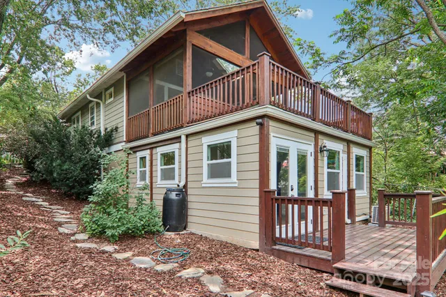 aerial view of a house with a yard and potted plants