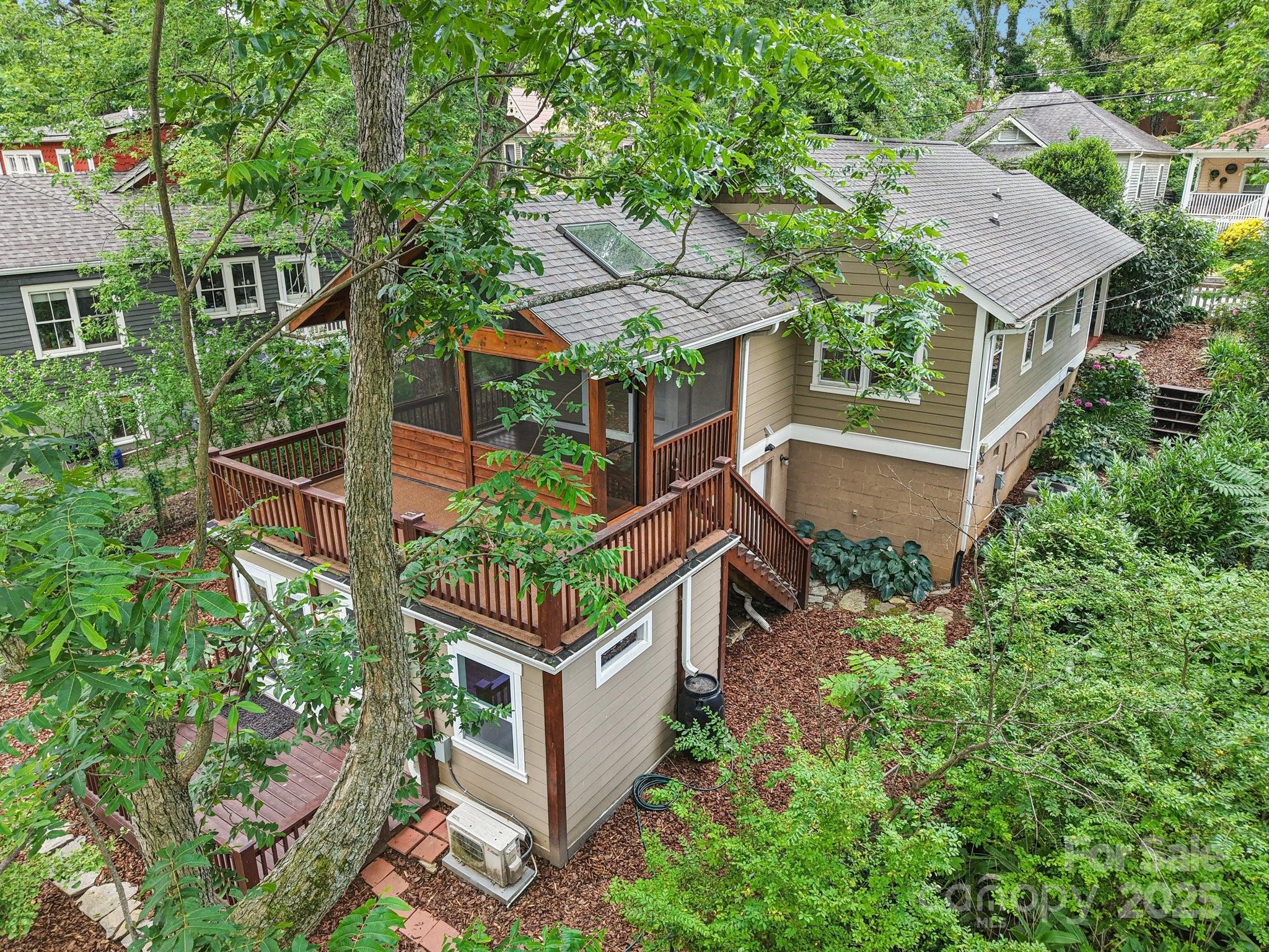 39 Short Street Asheville, NC 28801 - Photo 37 of 47 aerial view of a house with a yard and potted plants