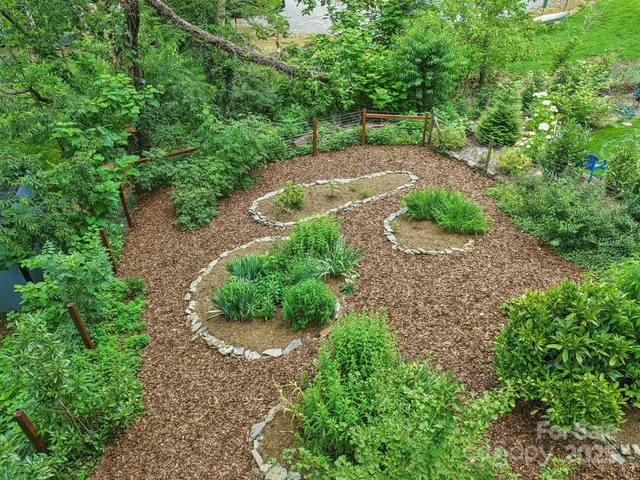 aerial view of a house with a yard