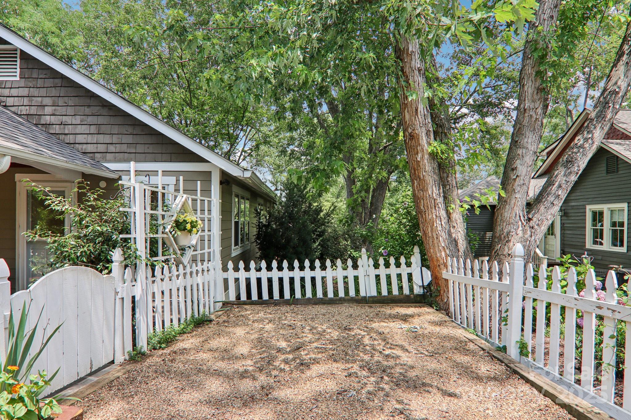 39 Short Street Asheville, NC 28801 - Photo 7 of 47 a view of a house with a small yard and wooden fence
