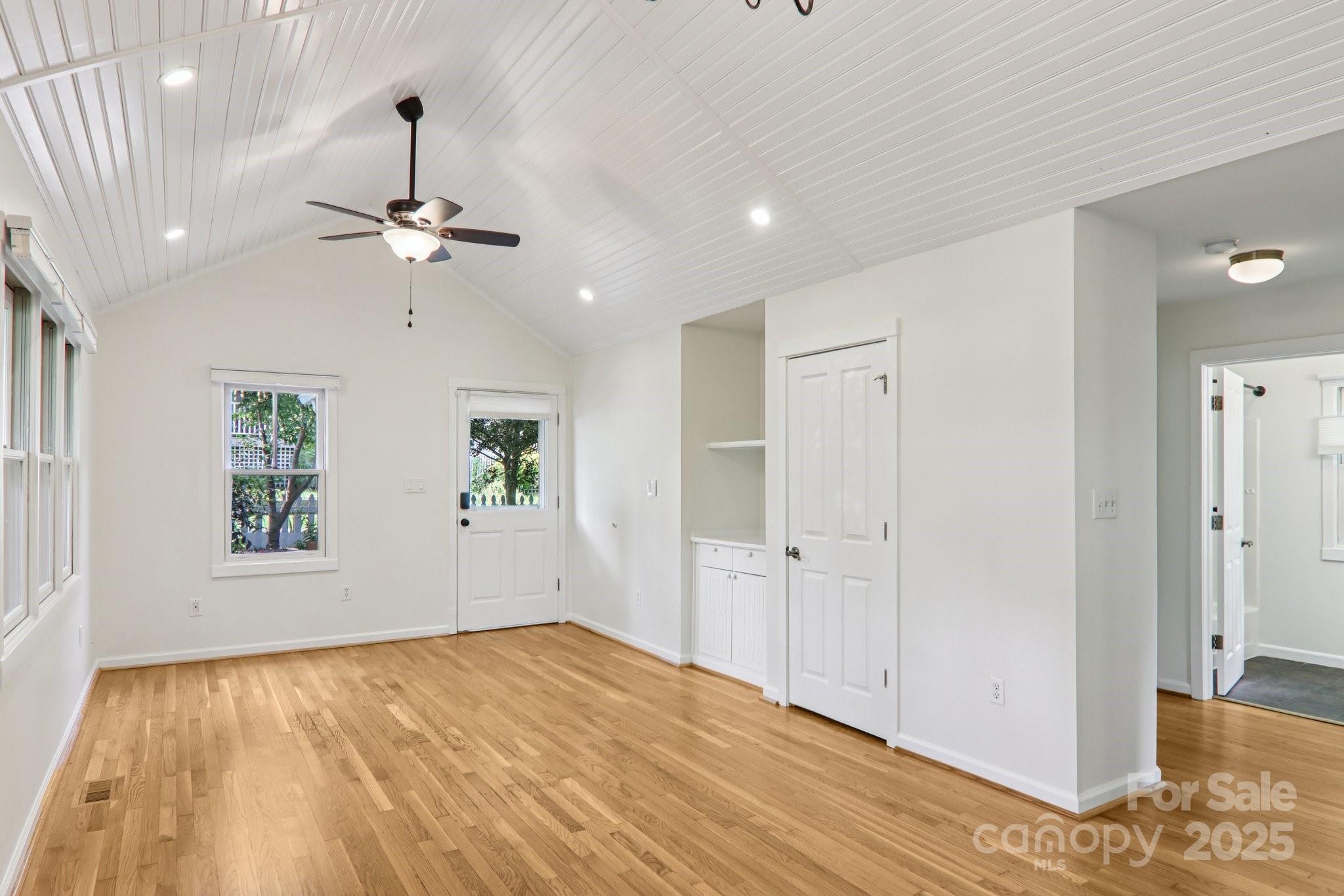 39 Short Street Asheville, NC 28801 - Photo 9 of 47 a view of empty room with wooden floor and ceiling fan