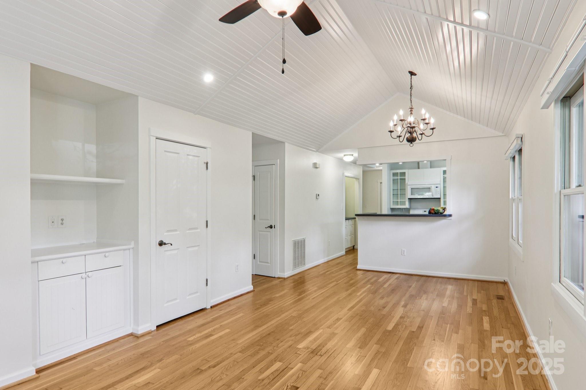 39 Short Street Asheville, NC 28801 - Photo 10 of 47 a view of a livingroom with a chandelier fan and wooden floor