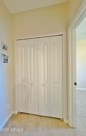 a kitchen with a refrigerator and a stove top oven