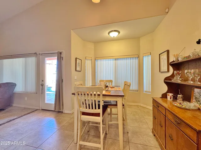 a view of a kitchen with furniture and windows