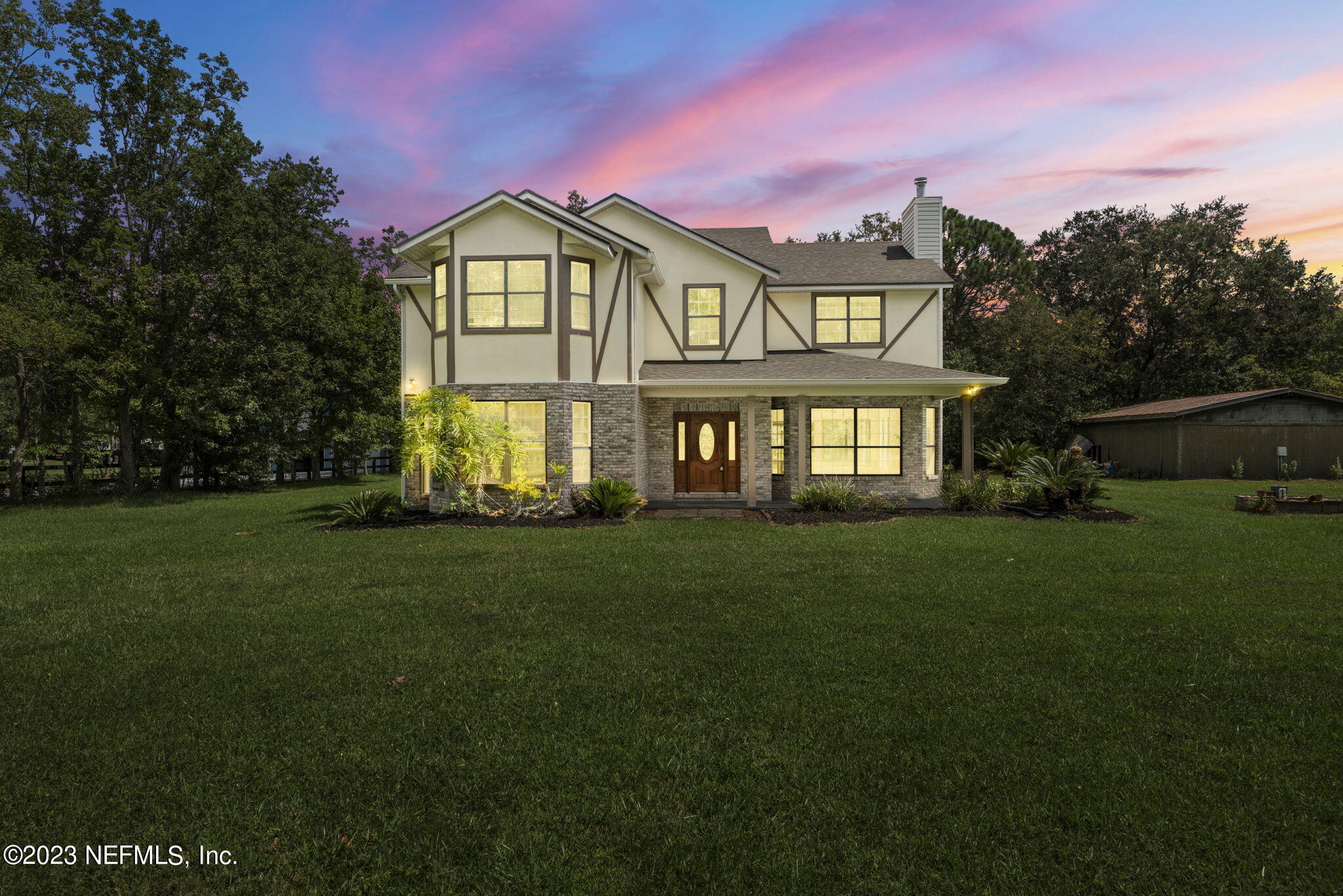 1387 Lee Road St. Johns, FL 32259 - Photo 1 of 62 a front view of a house with a garden